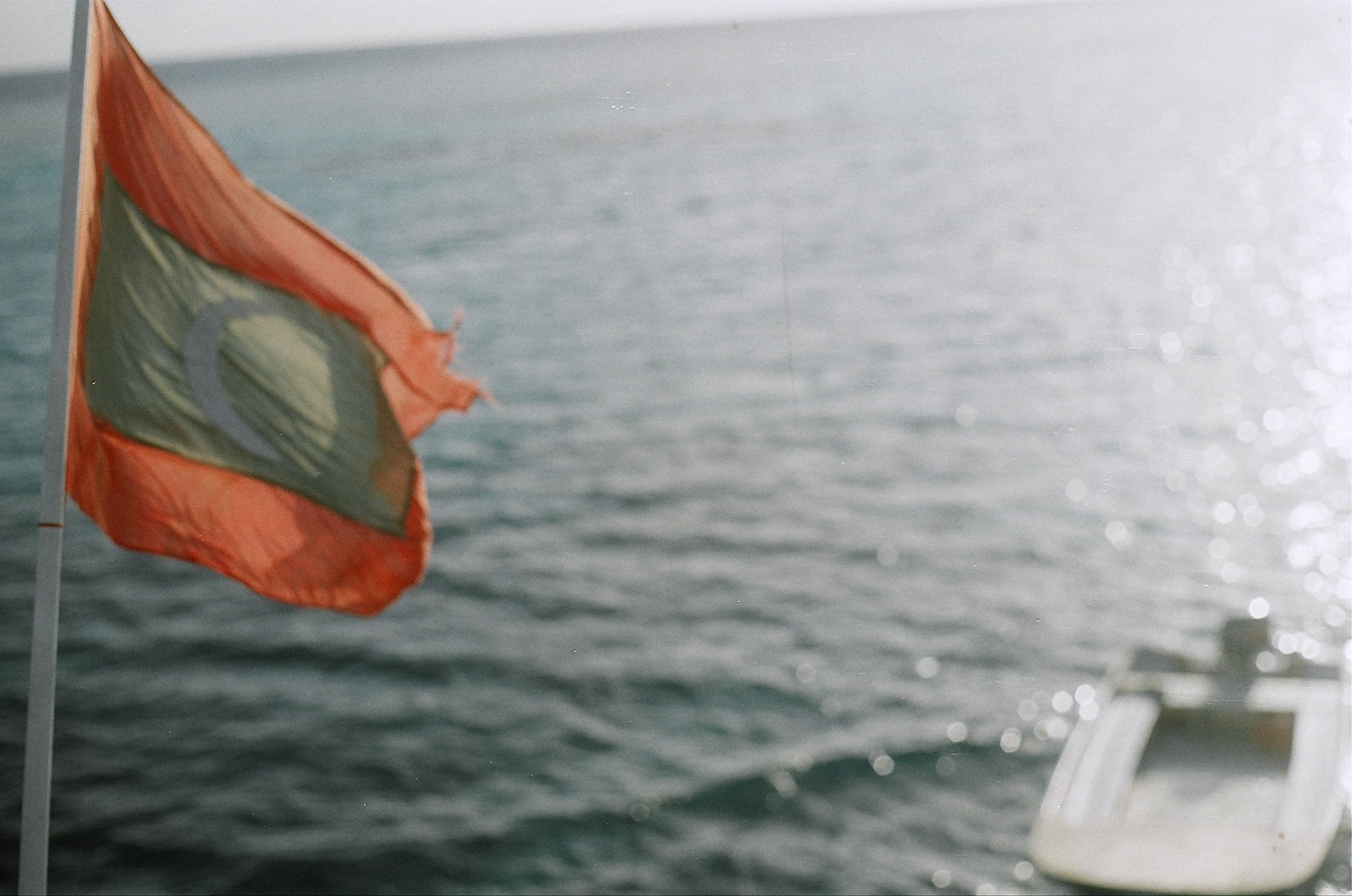 Maldivian flag over ocean